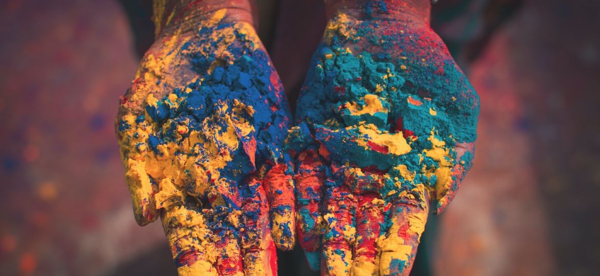 closeup photo of person holding color soils
